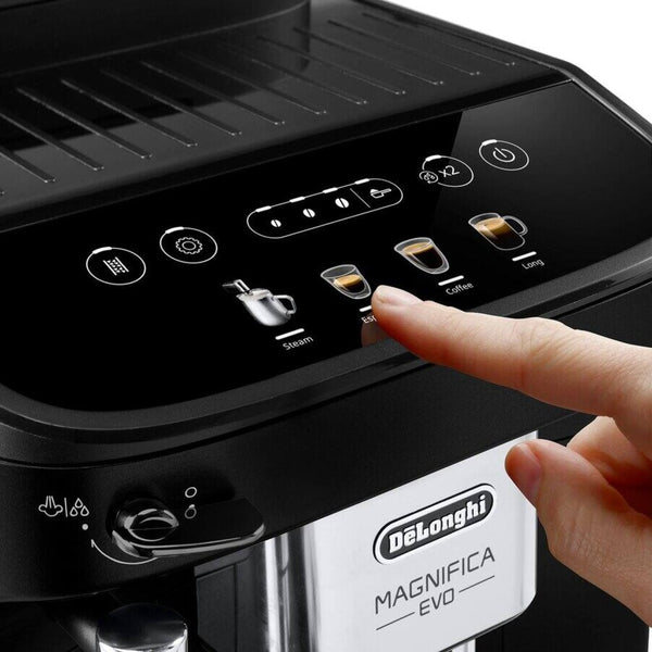 De'Longhi Magnifica Evo coffee machine with a hand pressing a button on the control panel.
